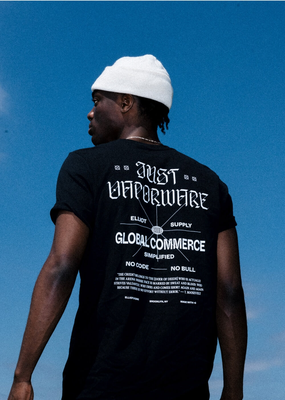 A guy posing with the Vaporware T-shirt